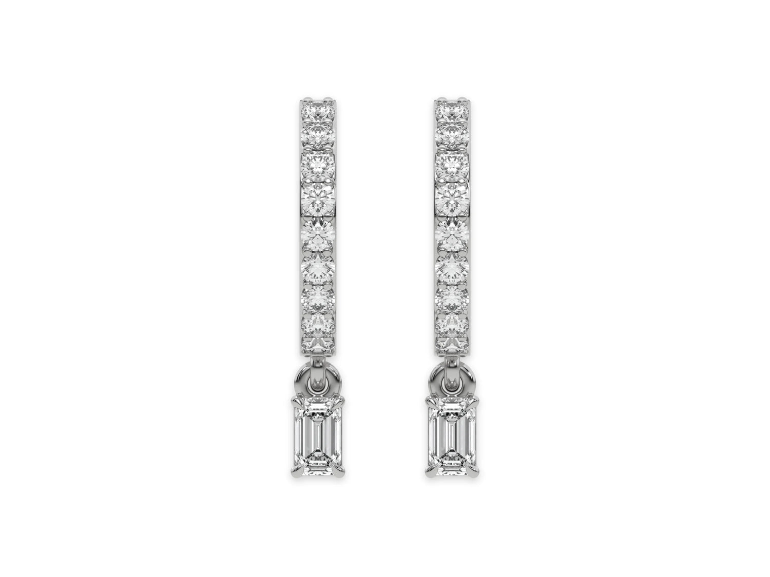 18k white gold dangling emerald diamond hoop earrings with round cut diamonds in prong setting in hoop and an emerald solitaire hanging at the bottom.