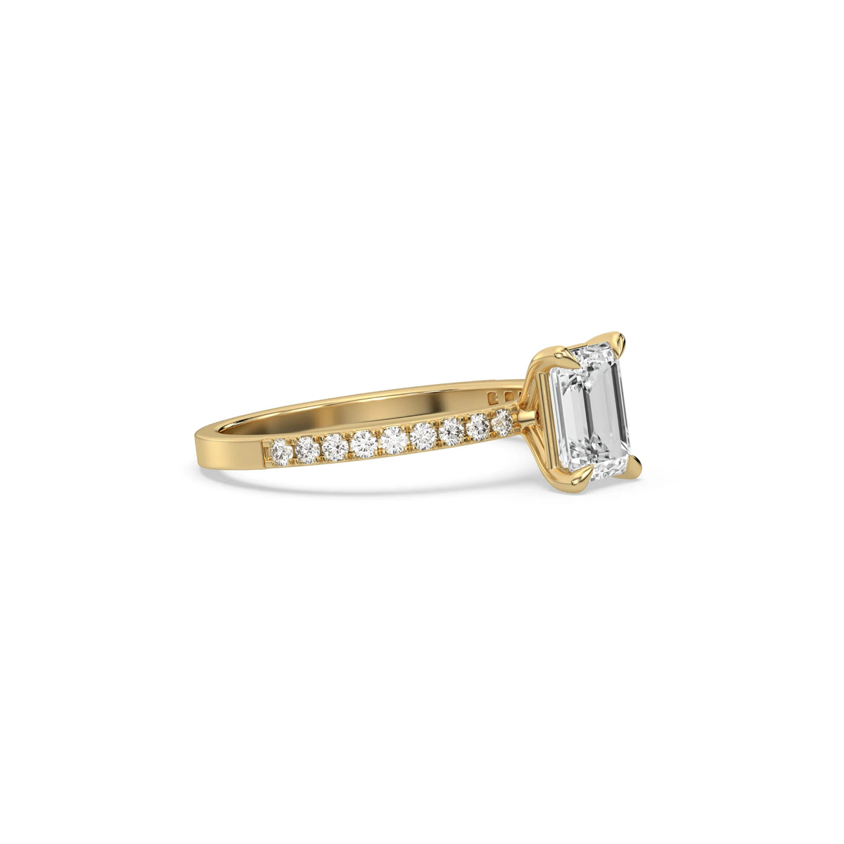 This yellow gold ring displayed in side view is made with a emerald solitaire diamond set in four-prong setting