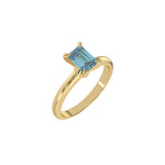 This yellow gold ring features an fancy Blue emerald solitaire diamond elegantly secured in a four-prong setting on a solid gold band in 3D view