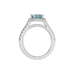 This white gold Cushion Diamond Halo Engagement Ring is made with a fancy Blue cushion solitaire diamond set in a four-prong setting in through finger view