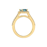 This yellow gold Radiant Diamond Halo Engagement Ring is made with a fancy Blue radiant solitaire diamond set in a four-prong setting in through finger view