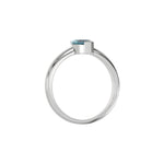 This white gold ring features a fancy Blue marquise solitaire diamond elegantly secured in a two v-prong setting on a solid gold band in through finger view