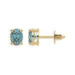 14k yellow gold oval diamond stud earrings made with a fancy blue oval cut diamond set in a four prong setting