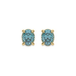 18k yellow gold oval diamond stud earrings made with a fancy blue oval cut diamond set in a four prong setting