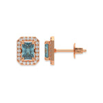 18k Rose gold Radiant Diamond Halo Earrings made with a fancy blue radiant cut solitaire diamond set in a four prong setting.