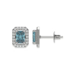 18k white gold Radiant Diamond Halo Earrings made with a fancy blue radiant cut solitaire diamond set in a four prong setting.