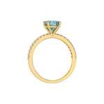 This yellow gold ring is made with a fancy Blue round solitaire diamond set in four-prong setting in through finger view