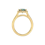 This yellow gold ring features a fancy Green round solitaire diamond set in a four-prong setting in through finger view