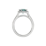 This white gold ring features a fancy Green round solitaire diamond set in a four-prong setting in through finger view