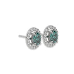 This white gold Classic Oval Diamond Halo Earrings made with an fancy green oval cut solitaire diamonds set in a four prong setting in side view 