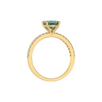 This yellow gold ring is made with an fancy Green oval solitaire diamond set in four-prong setting, and is complemented by a round pave diamonds band in through finger view