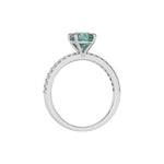 This white gold ring is made with a fancy green round solitaire diamond set in four-prong setting in through finger view