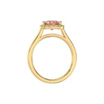 This yellow gold ring features a fancy Pink round solitaire diamond set in a four-prong setting in through finger view