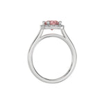 This white gold ring features a fancy Pink round solitaire diamond set in a four-prong setting in through finger view