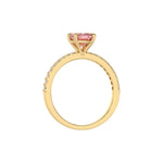 This yellow gold ring displayed in through finger view is made with a cushion solitaire diamond set in four-prong setting