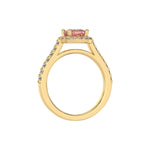 This yellow gold Cushion Diamond Halo Engagement Ring is made with a fancy Pink cushion solitaire diamond set in a four-prong setting in through finger view