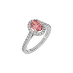 This white gold Oval Diamond Halo Engagement Ring is made with a fancy pink oval solitaire diamond set in a four-prong setting, surrounded by a halo of round diamonds all set on a pave band in 3D view