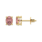 18k yellow gold oval diamond earrings made with a fancy pink oval cut diamond set in a four prong setting