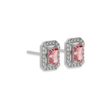 This white gold Classic Radiant Diamond Halo Earrings made with a fancy pink radiant cut solitaire diamonds set in a four prong setting in side view