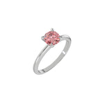 This white gold ring features a fancy Pink round solitaire diamond elegantly secured in a four-prong setting on a solid gold band in 3D view