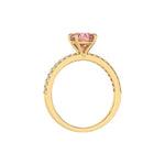 This yellow gold ring is made with a fancy Pink round solitaire diamond set in four-prong setting in through finger view