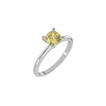 This white gold ring features a fancy Yellow cushion solitaire diamond elegantly secured in a four-prong setting on a solid gold band in 3D view