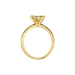 This yellow gold ring features a fancy Yellow cushion solitaire diamond elegantly secured in a four-prong setting on a solid gold band in through finger view