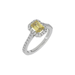 This white gold Emerald Diamond Halo Engagement Ring is made with a fancy yellow emerald solitaire diamond set in a four-prong setting in 3D view