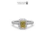 This white  gold ring displayed in front view is made with a Emerald solitaire diamond set in four-prong setting