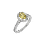 This white gold Oval Diamond Halo Engagement Ring is made with a fancy yellow oval solitaire diamond set in a four-prong setting, surrounded by a halo of round diamonds all set on a pave band in 3D view