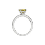 This white gold ring is made with an fancy Yellow oval solitaire diamond set in four-prong setting, and is complemented by a round pave diamonds band in through finger view