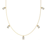 Oval Dangling Diamond Necklace made with five oval cut diamonds each set in a prong setting, distributed evenly along the chain