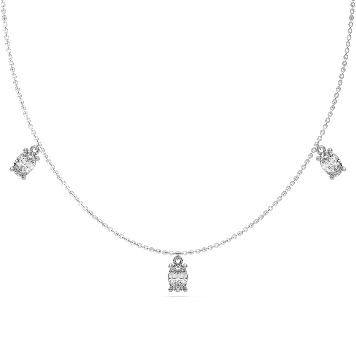 Oval Dangling Diamond Necklace made with five oval cut diamonds each set in a prong setting, distributed evenly along the chain