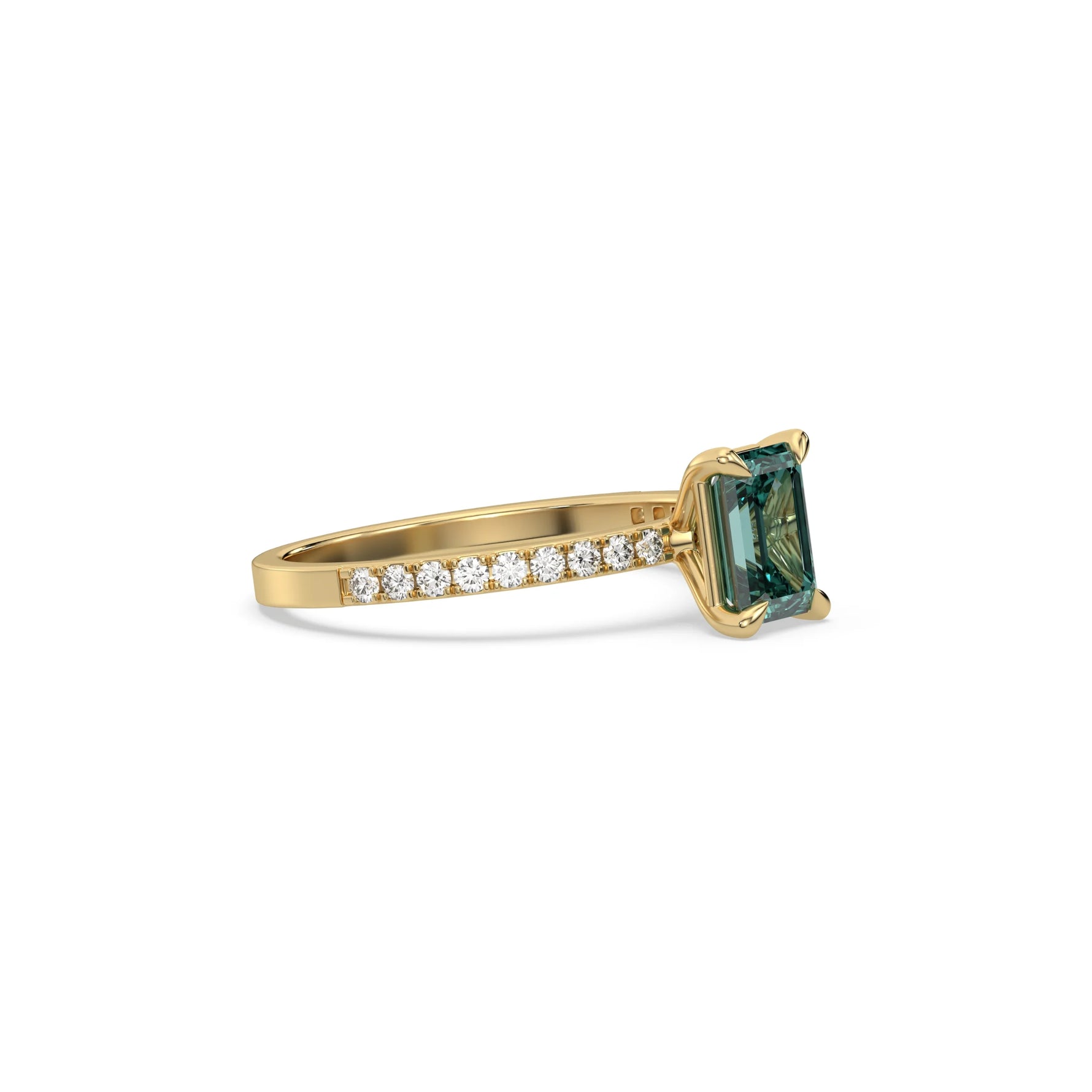 This yellow gold ring displayed in side view is made with a emerald solitaire diamond set in four-prong setting