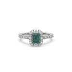 This white gold ring displayed in front view is made with a Emerald solitaire diamond set in four-prong setting