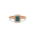 This rose gold ring displayed in front view is made with a Emerald solitaire diamond set in four-prong setting