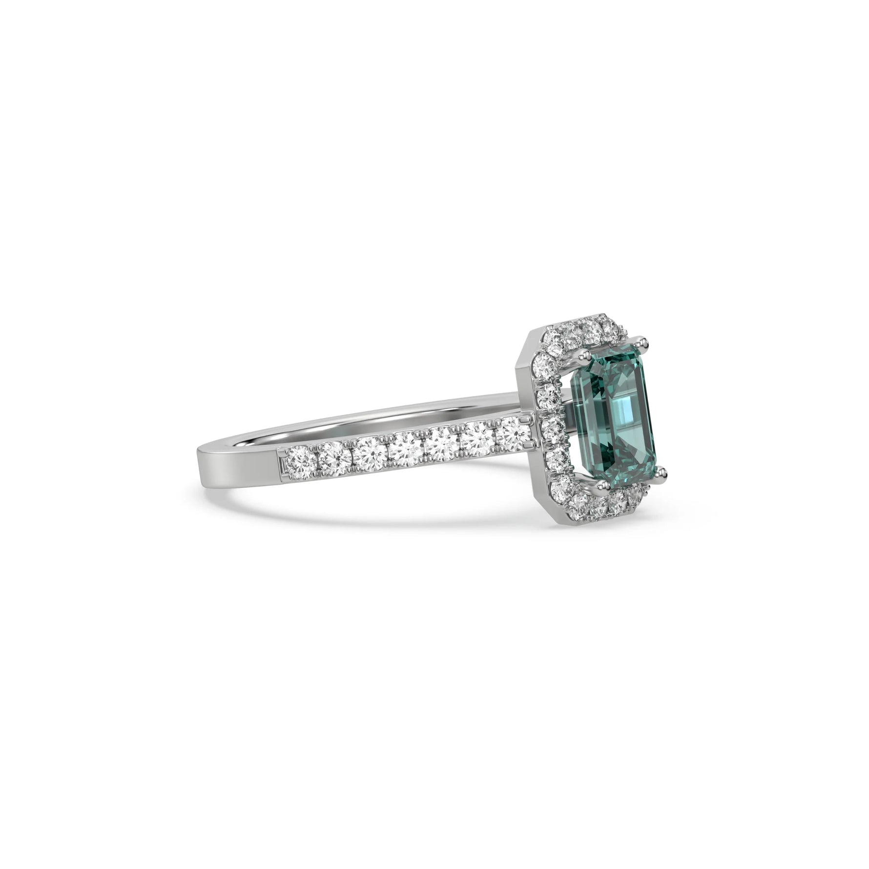 This white gold ring displayed in side view is made with a Emerald solitaire diamond set in four-prong setting