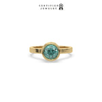 This yellow gold ring displayed on front view is made with brilliant round solitaire diamond set in bezel setting