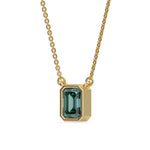 This yellow gold Fancy Green Emerald Solitaire Diamond Necklace made with an fancy Green emerald cut diamond in bezel setting with adjustable chain in side  view