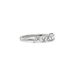 This white gold ring displayed on side view is made with round brilliant-cut diamonds and baguette set in a prong setting