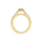 This yellow gold Cushion Diamond Halo Engagement Ring is made with a cushion solitaire diamond set in a four-prong setting, surrounded by a halo of round diamonds all set on a pave band in through finger view