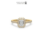 This yellow gold ring displayed in front view is made with a Emerald solitaire diamond set in four-prong setting