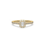 This yellow gold ring displayed in front view is made with a Emerald solitaire diamond set in four-prong setting