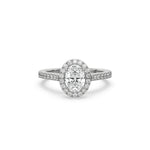 This white gold ring displayed in front view is made with a oval solitaire diamond set in four-prong setting