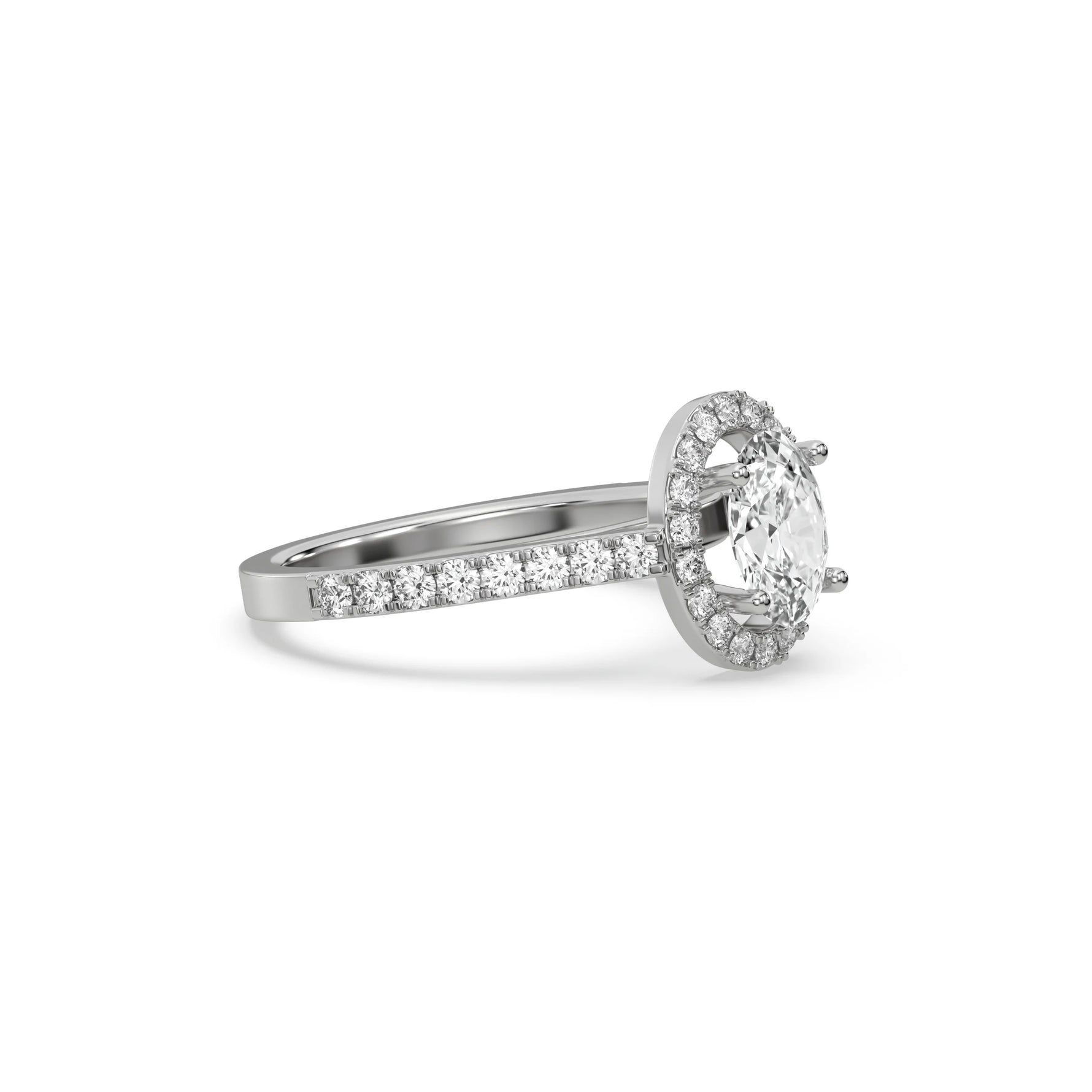 This white gold ring displayed in side view is made with a oval solitaire diamond set in four-prong setting