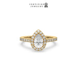 This yellow gold ring displayed in front view is made with a pear solitaire diamond set in four-prong setting