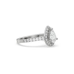 This white gold ring displayed in side view is made with a pear solitaire diamond set in four-prong setting