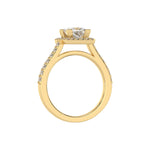 This yellow gold Princess Diamond Halo Engagement Ring is made with a princess solitaire diamond set in a four-prong setting, surrounded by a halo of round diamonds all set on a pave band in through finger view