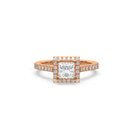 This rose gold ring displayed in front view is made with a princess solitaire diamond set in four-prong setting