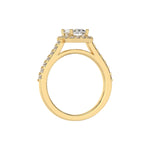 This yellow gold Radiant Diamond Halo Engagement Ring is made with a radiant solitaire diamond set in a four-prong setting, surrounded by a halo of round diamonds all set on a pave band in through finger view